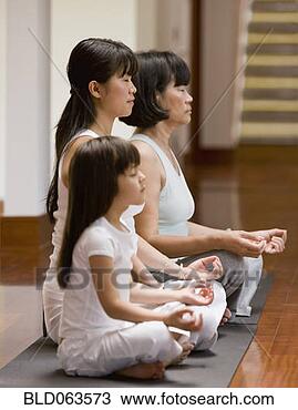 Stock Photo - asian family practicing 
yoga. fotosearch 
- search stock 
photos, pictures, 
images, and photo 
clipart