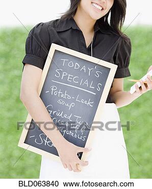 Stock Photography - asian waitress 
holding chalkboard 
with day’s specials. 
fotosearch - search 
stock photos, 
pictures, images, 
and photo clipart