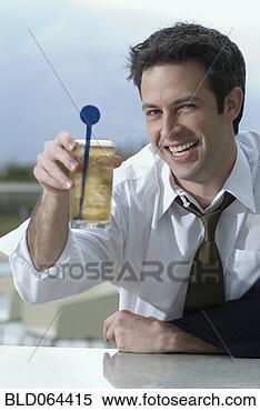 Stock Image - hispanic businessman 
drinking cocktail. 
fotosearch - search 
stock photos, 
pictures, images, 
and photo clipart