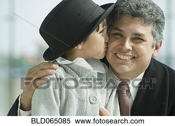 Stock Image - hispanic girl 
kissing father’s 
cheek. fotosearch 
- search stock 
photos, pictures, 
images, and photo 
clipart