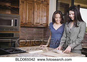 Stock Photo - hispanic woman 
working with interior 
designer. fotosearch 
- search stock 
photos, pictures, 
images, and photo 
clipart