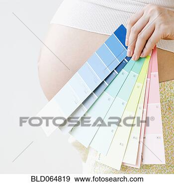 Stock Photograph - pregnant asian 
woman holding 
several color 
swatches. fotosearch 
- search stock 
photos, pictures, 
images, and photo 
clipart