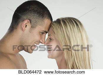 Stock Photo - smiling hispanic 
couple face to 
face. fotosearch 
- search stock 
photos, pictures, 
images, and photo 
clipart