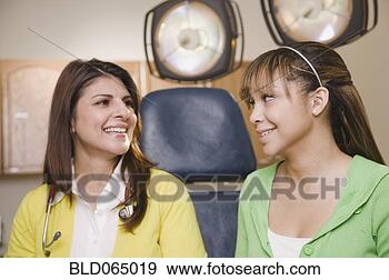 Stock Photograph - teenage girl having 
checkup in doctor’s 
office. fotosearch 
- search stock 
photos, pictures, 
images, and photo 
clipart