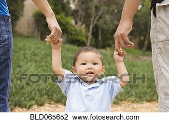 Stock Photo - asian parents 
supporting son. 
fotosearch - search 
stock photos, 
pictures, images, 
and photo clipart