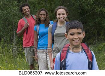 Picture - mixed race family 
hiking with backpacks. 
fotosearch - search 
stock photos, 
pictures, images, 
and photo clipart