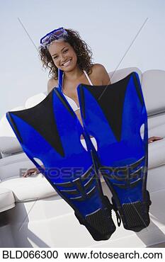 Stock Photography - mixed race woman 
in snorkel gear 
on boat. fotosearch 
- search stock 
photos, pictures, 
images, and photo 
clipart