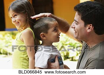 Stock Image - father comparing 
children’s height. 
fotosearch - search 
stock photos, 
pictures, images, 
and photo clipart