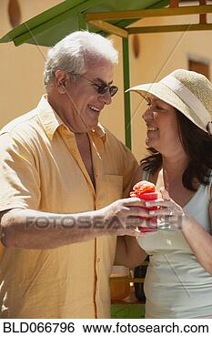 Stock Photo - hispanic couple 
drinking frozen 
drink. fotosearch 
- search stock 
photos, pictures, 
images, and photo 
clipart