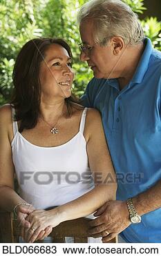 Stock Photo - hispanic couple 
smiling and hugging. 
fotosearch - search 
stock photos, 
pictures, images, 
and photo clipart