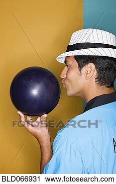 Stock Photography - hispanic man kissing 
bowling ball. 
fotosearch - search 
stock photos, 
pictures, images, 
and photo clipart