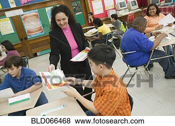 Stock Photo - hispanic school 
teacher presenting 
award to student. 
fotosearch - search 
stock photos, 
pictures, images, 
and photo clipart