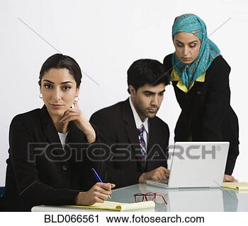 Stock Photography - middle eastern 
business people 
working. fotosearch 
- search stock 
photos, pictures, 
images, and photo 
clipart