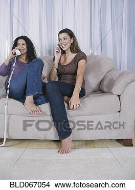 Stock Photo - mother and adult 
daughter using 
different phones. 
fotosearch - search 
stock photos, 
pictures, images, 
and photo clipart
