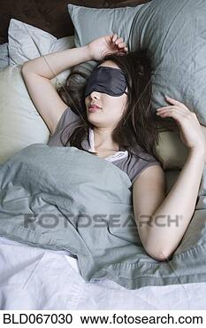 Stock Photography - woman sleeping 
with eye mask. 
fotosearch - search 
stock photos, 
pictures, images, 
and photo clipart