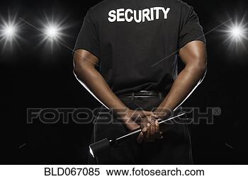 Stock Image - african security 
guard holding 
flashlight. fotosearch 
- search stock 
photos, pictures, 
images, and photo 
clipart
