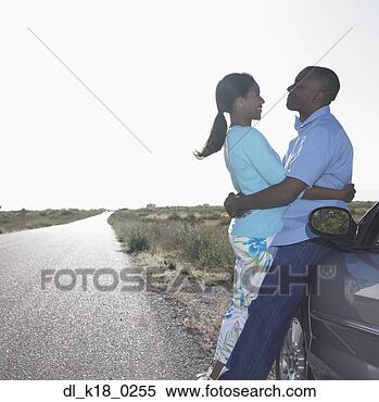 Stock Image - side profile of 
a mid adult couple 
embracing each 
other. fotosearch 
- search stock 
photos, pictures, 
images, and photo 
clipart