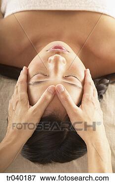 Picture - woman receiving 
a facial massage. 
fotosearch - search 
stock photos, 
pictures, images, 
and photo clipart