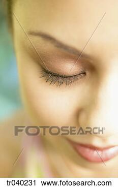 Stock Photography - young woman smiling 
with eyes closed. 
fotosearch - search 
stock photos, 
pictures, images, 
and photo clipart