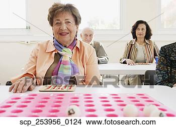 Stock Photo - elderly woman 
playing bingo. 
fotosearch - search 
stock photos, 
pictures, images, 
and photo clipart