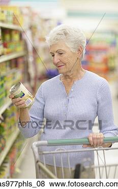 Stock Photo - woman reading 
can label in store. 
fotosearch - search 
stock photos, 
pictures, images, 
and photo clipart