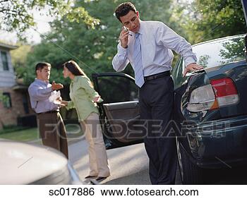 Stock Photo - businessman talking 
on his cell phone 
by a car accident. 
fotosearch - search 
stock photos, 
pictures, images, 
and photo clipart