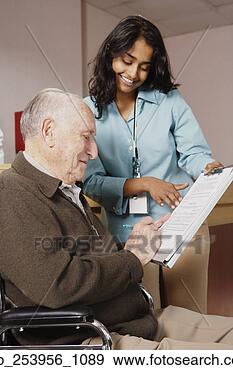 Stock Photograph - nurse holding 
a form for an 
elderly man to 
sign. fotosearch 
- search stock 
photos, pictures, 
images, and photo 
clipart