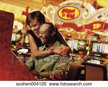 Stock Photography - mid adult couple 
playing in a casino. 
fotosearch - search 
stock photos, 
pictures, images, 
and photo clipart