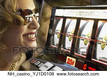 Stock Photo - young woman winning 
at the slot machine. 
fotosearch - search 
stock photos, 
pictures, images, 
and photo clipart