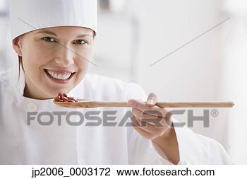 Stock Photo - female chef tasting 
beans. fotosearch 
- search stock 
photos, pictures, 
images, and photo 
clipart