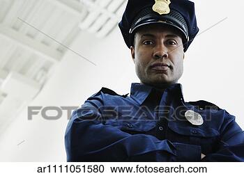 Stock Photography - low angle view 
of security guard. 
fotosearch - search 
stock photos, 
pictures, images, 
and photo clipart
