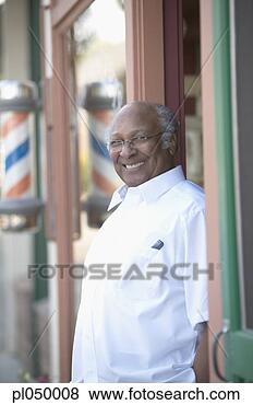 Stock Photo - portrait of a 
barber smiling 
at a doorway. 
fotosearch - search 
stock photos, 
pictures, images, 
and photo clipart