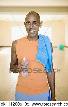 Stock Image - young man drinking 
a bottle of water. 
fotosearch - search 
stock photos, 
pictures, images, 
and photo clipart