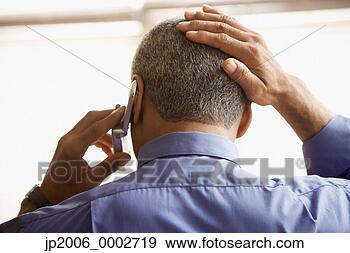 Stock Photograph - businessman talking 
on his cell phone. 
fotosearch - search 
stock photos, 
pictures, images, 
and photo clipart