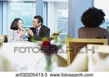 Stock Photo - businessman and 
a businesswoman 
toasting wine 
in a restaurant. 
fotosearch - search 
stock photos, 
pictures, images, 
and photo clipart