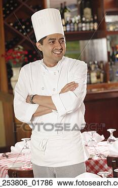 Stock Photo - chef posing for 
the camera in 
a restaurant. 
fotosearch - search 
stock photos, 
pictures, images, 
and photo clipart