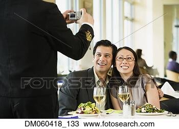 Stock Photo - couple having 
photograph taken 
at restaurant. 
fotosearch - search 
stock photos, 
pictures, images, 
and photo clipart