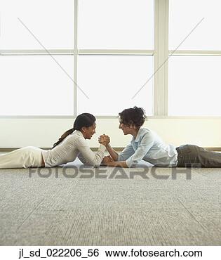 Stock Photo - asian businesswomen 
arm wrestling 
on the floor, 
 redwood city. 
fotosearch - search 
stock photos, 
pictures, images, 
and photo clipart