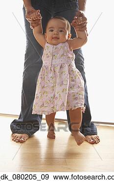 Stock Photograph - mother helping 
her baby walk. 
fotosearch - search 
stock photos, 
pictures, images, 
and photo clipart