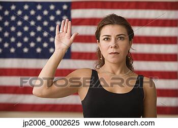 Stock Image - woman raising 
her hand with 
an american flag 
in background. 
fotosearch - search 
stock photos, 
pictures, images, 
and photo clipart