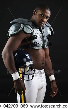 Stock Photograph - portrait of a 
teenage boy standing 
wearing football 
gear. fotosearch 
- search stock 
photos, pictures, 
images, and photo 
clipart
