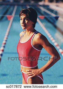 Stock Photo - young woman posing 
for the camera 
by a swimming 
pool. fotosearch 
- search stock 
photos, pictures, 
images, and photo 
clipart
