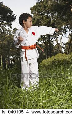 Stock Photo - close-up of a 
boy practicing 
judo in a garden. 
fotosearch - search 
stock photos, 
pictures, images, 
and photo clipart