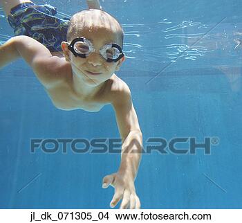 Stock Photo - young boy swimming 
in a pool. fotosearch 
- search stock 
photos, pictures, 
images, and photo 
clipart