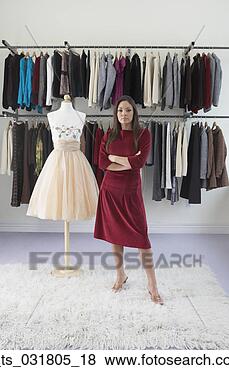 Stock Photo - portrait of a 
fashion designer 
standing in front 
of a mannequin 
and. fotosearch 
- search stock 
photos, pictures, 
images, and photo 
clipart