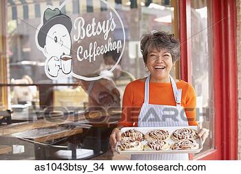 Stock Photo - portrait of woman 
with tray of cinnamon 
rolls outside 
coffee shop. fotosearch 
- search stock 
photos, pictures, 
images, and photo 
clipart