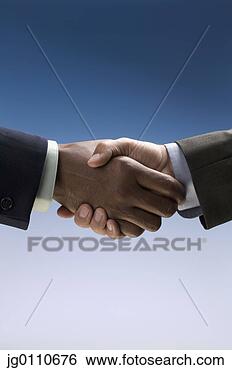 Stock Photo - businessmen shaking 
hands. fotosearch 
- search stock 
photos, pictures, 
images, and photo 
clipart