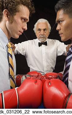 Stock Photo - two businessmen 
facing each other 
in boxing ring. 
fotosearch - search 
stock photos, 
pictures, images, 
and photo clipart