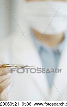 Banco de Imagem - fim,  cima,  dental, 
 ferramenta,  
dentista,  mão. 
fotosearch - busca 
de fotos, imagens 
e clipart