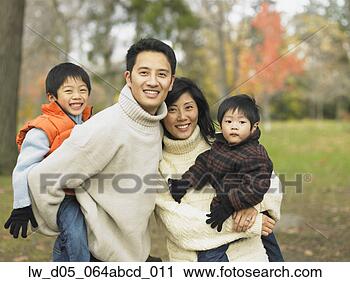 Stock Photography - asian family with 
young children 
in the park, toronto, 
canada. fotosearch 
- search stock 
photos, pictures, 
images, and photo 
clipart